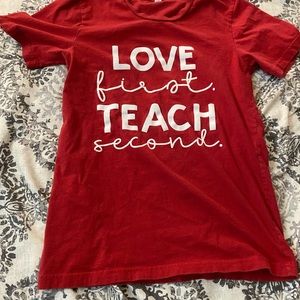 Red teacher shirt.